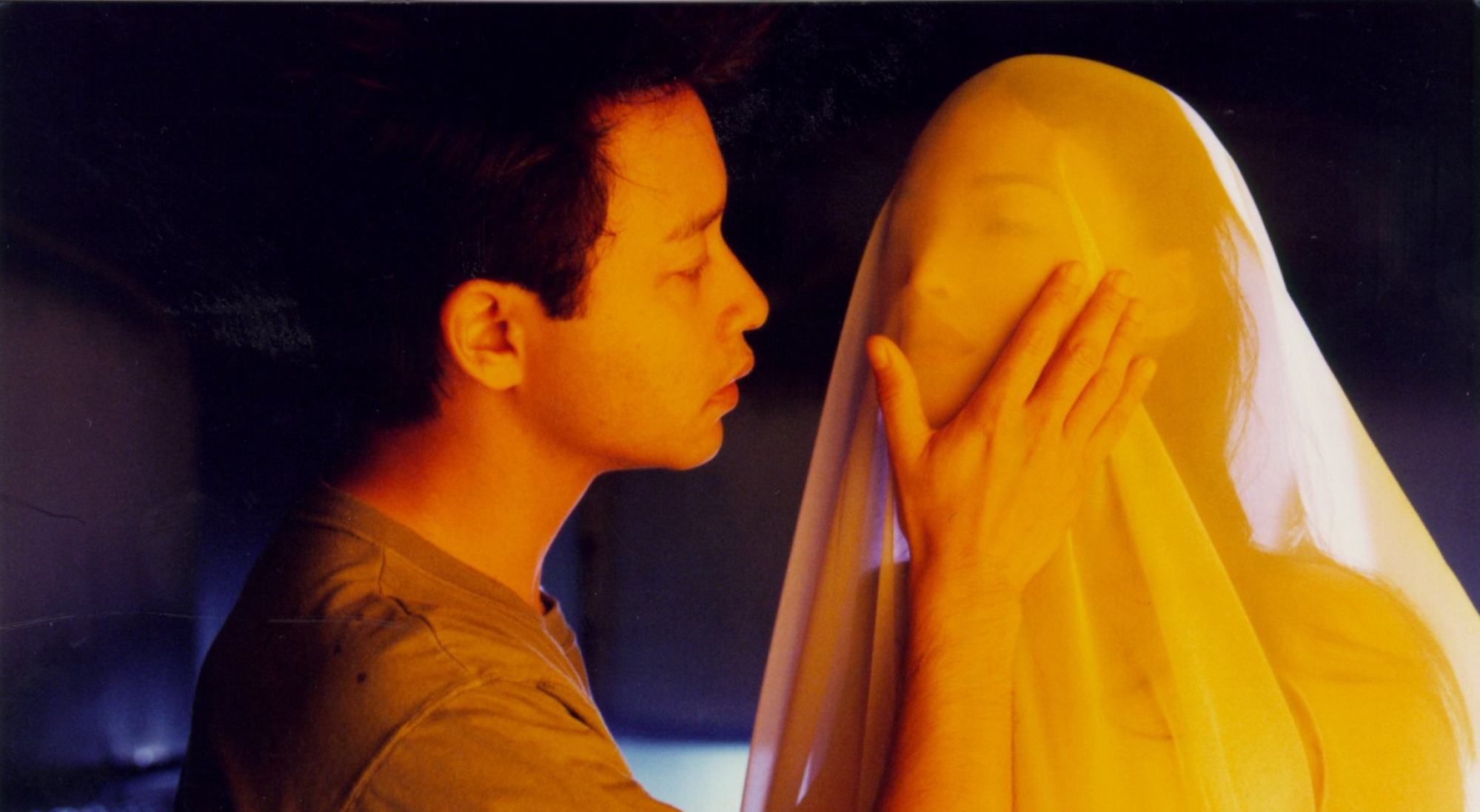 Leslie Cheung (left) and Shu Qi in a still from Viva Erotica.