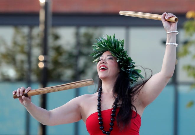 Nā Hale Studios performs for the audience during an Asian American, Pacific Islander heritage celebration at Green Bay Packers' Titletown District on May 15, 2024, in Ashwaubenon, Wis.