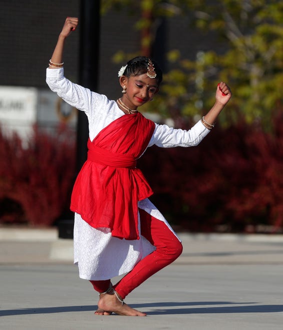 Dancers from AUM Performing Arts perform for the audience during an Asian American, Pacific Islander heritage celebration at Green Bay Packers' Titletown District on May 15, 2024, in Ashwaubenon, Wis.