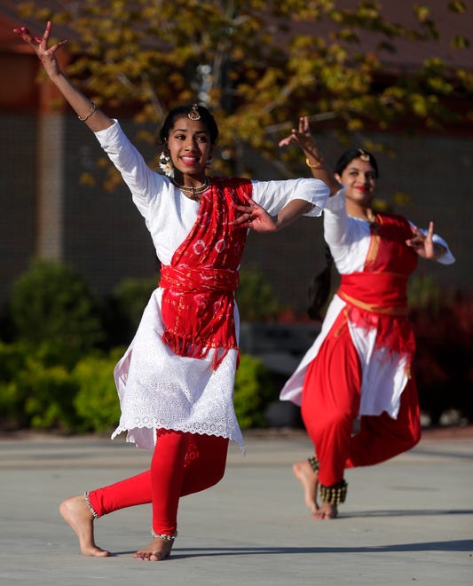 Dancers from AUM Performing Arts perform for the audience during an Asian American, Pacific Islander heritage celebration at Green Bay Packers' Titletown District on May 15, 2024, in Ashwaubenon, Wis.