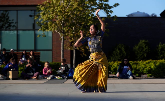 AUM Performing Arts performs for the audience during an Asian American, Pacific Islander heritage celebration at Green Bay Packers' Titletown District on May 15, 2024, in Ashwaubenon, Wis.