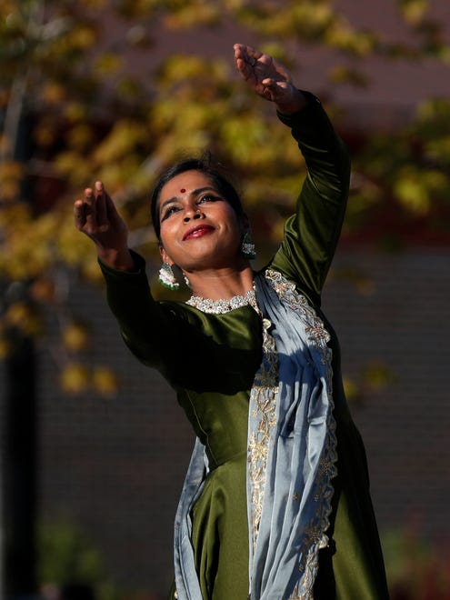 Cyenthia Vijayakumar of Aarambh Kathak Dance School performs for the audience during an Asian American, Pacific Islander heritage celebration at Green Bay Packers' Titletown District on May 15, 2024, in Ashwaubenon, Wis.