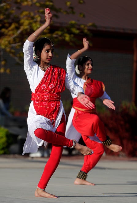 Dancers from AUM Performing Arts perform for the audience during an Asian American, Pacific Islander heritage celebration at Green Bay Packers' Titletown District on May 15, 2024, in Ashwaubenon, Wis.
