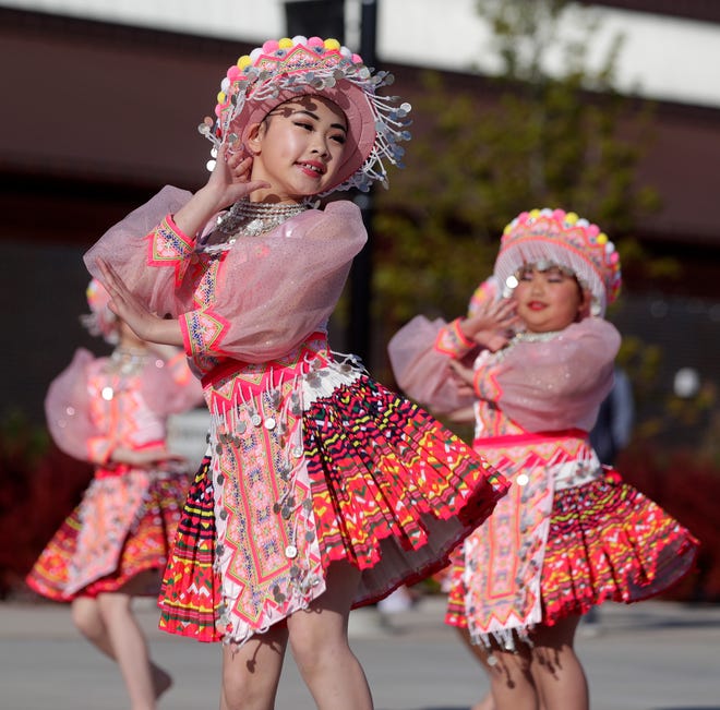 Dancers from Nkauj Zaj Dance Academy perform for the audience during an Asian American, Pacific Islander heritage celebration at Green Bay Packers' Titletown District on May 15, 2024, in Ashwaubenon, Wis.