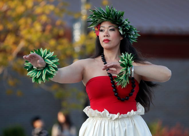 Nā Hale Studios performs for the audience during an Asian American, Pacific Islander heritage celebration at Green Bay Packers' Titletown District on May 15, 2024, in Ashwaubenon, Wis.