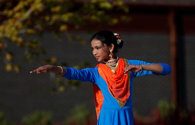 Dancers from Aarambh Kathak Dance School perform for the audience during an Asian American, Pacific Islander heritage celebration at Green Bay Packers' Titletown District on May 15, 2024, in Ashwaubenon, Wis.