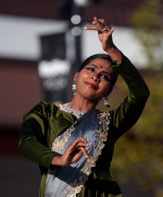 Cyenthia Vijayakumar of Aarambh Kathak Dance School performs for the audience during an Asian American, Pacific Islander heritage celebration at Green Bay Packers' Titletown District on May 15, 2024, in Ashwaubenon, Wis.