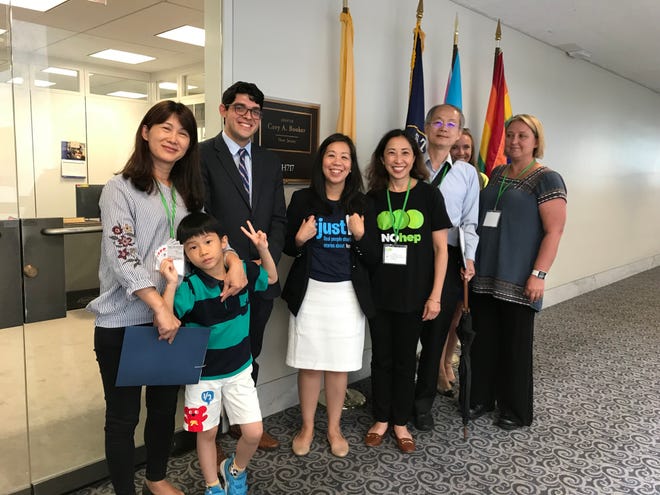 Jacki Chen, third from right, with his wife, son and physicians outside Sen. Cory Booker's office on Capitol Hill where they lobbied his staff for better funding for Hepatitis B.