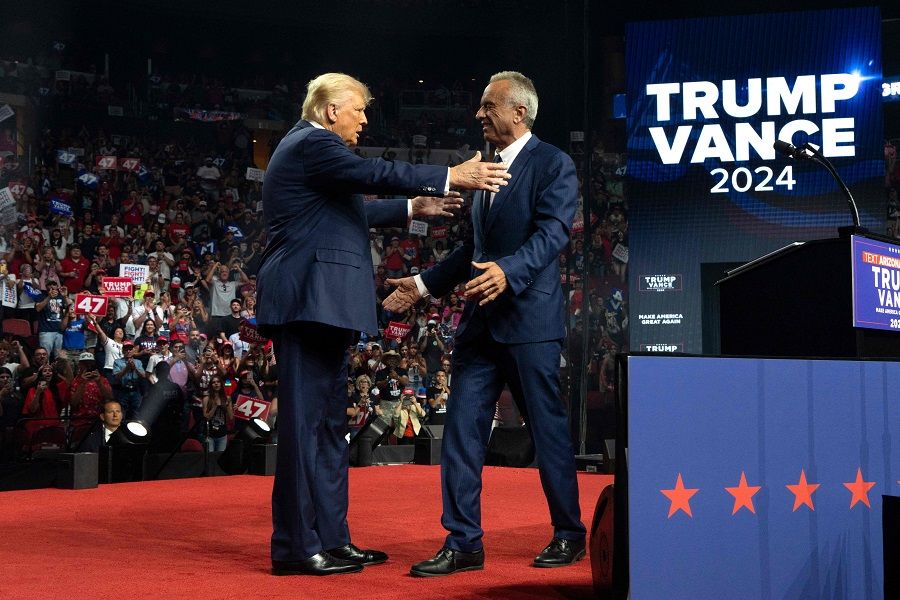 Republican presidential nominee and former US President Donald Trump (left) embraces former presidential candidate Robert F. Kennedy Jr. during a campaign rally at Desert Diamond Arena on 23 August 2024 in Glendale, Arizona, US. (Rebecca Noble/Getty Images/AFP)