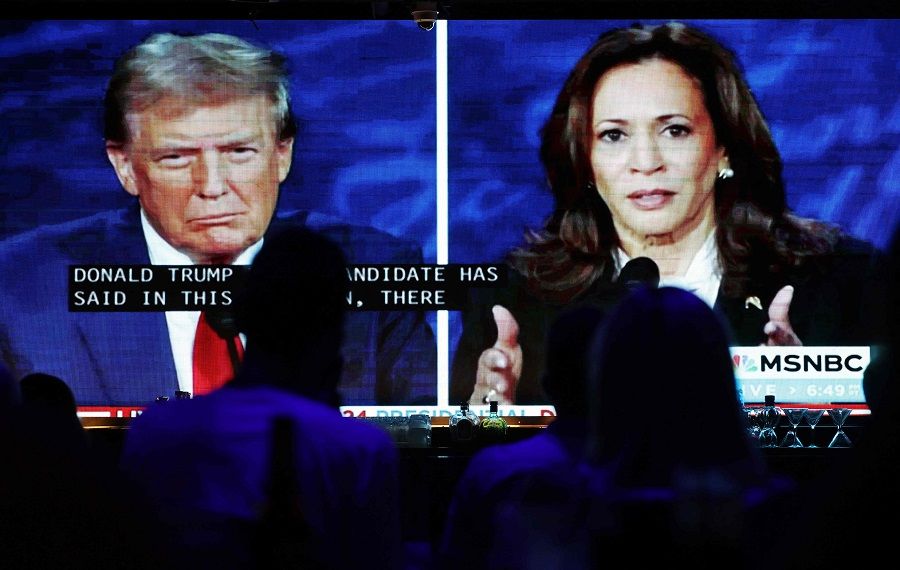People watch the ABC News presidential debate between Democratic presidential nominee, US Vice-President Kamala Harris and Republican presidential nominee, former US President Donald Trump at a debate watch party at The Abbey on 10 September 2024 in West Hollywood, California, US. (Mario Tama/Getty Images/AFP)
