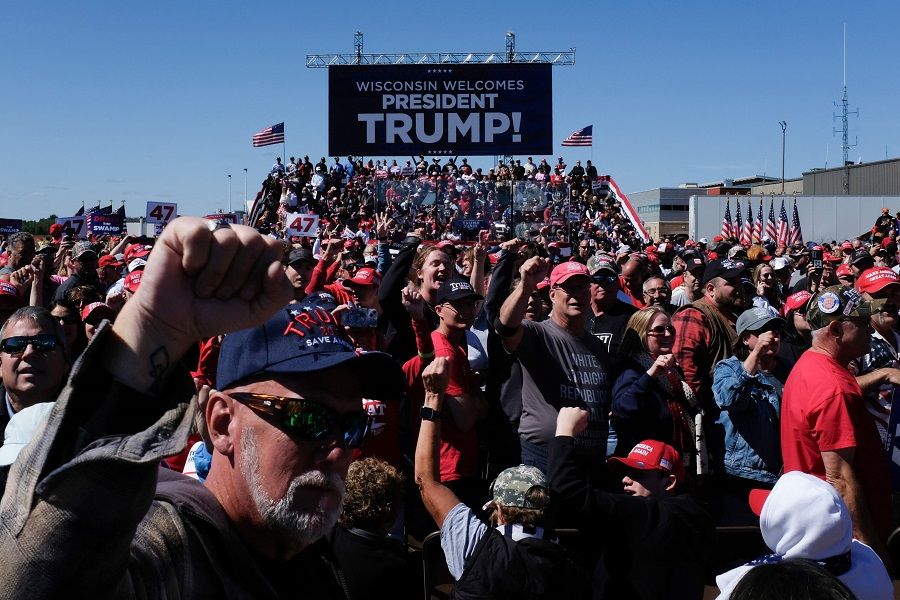 Supporters cheer as they wait for former US President and Republican presidential candidate Donald Trump at a campaign rally at the Central Wisconsin Airport in Mosinee, Wisconsin, US, on 7 September 2024. (Alex Wroblewski/AFP)