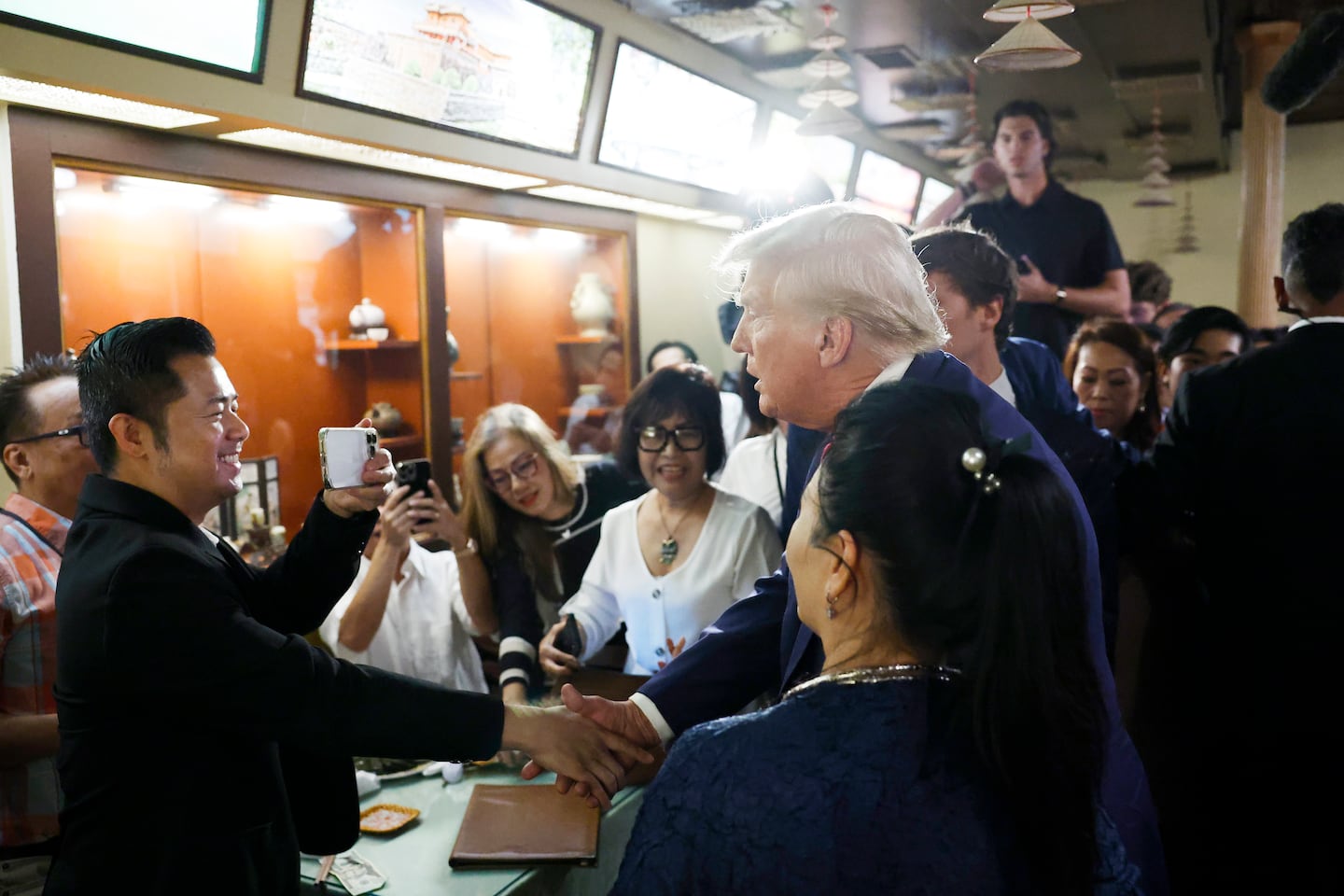 Republican presidential nominee, former president Donald Trump spoke with supporters at the Truong Tien Restaurant in the Eden Center on Aug. 26, 2024, in Falls Church, Va. 