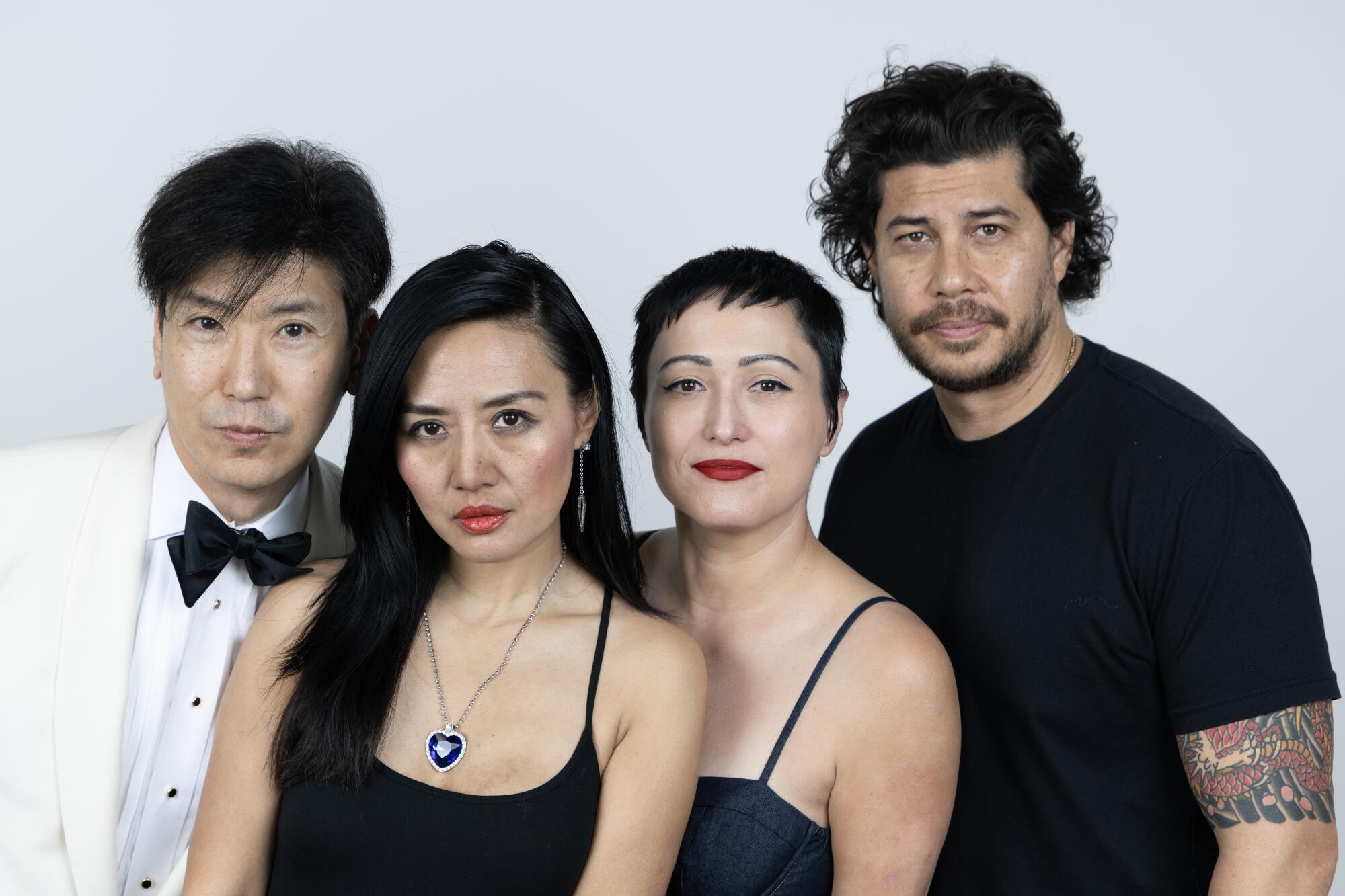 The crew of JoySauce in front of a white backdrop. 