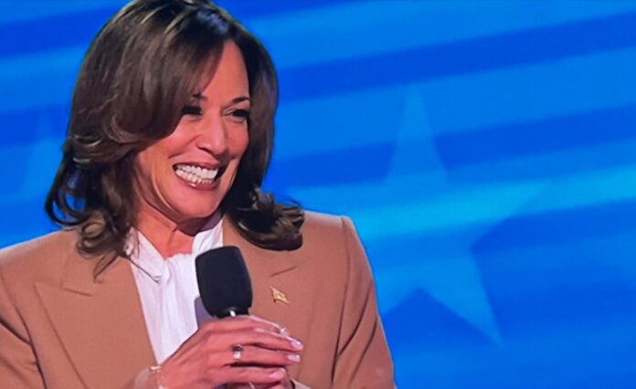 Kamala Harris beams during a surprise appearance Monday night at the Democratic Convention in Chicago.