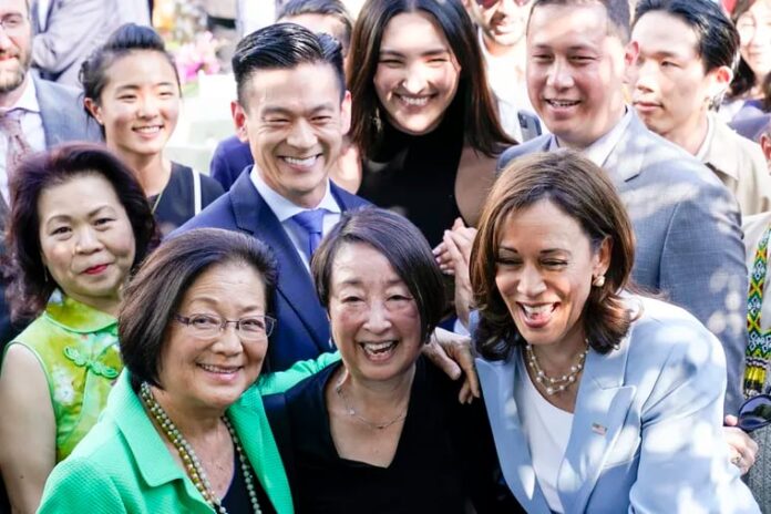 FILE - Vice President Kamala Harris takes a photo with Sen. Mazie Hirono, D-Hawaii, left, and others, in the Rose Garden of the White House in Washington, May 17, 2022, during a reception to celebrate Asian American, Native Hawaiian, and Pacific Islander Heritage Month. (AP Photo/Susan Walsh, File)