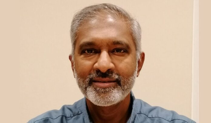 Portrait of Vijay Ramanaidoo, biochemistry laboratory manager.