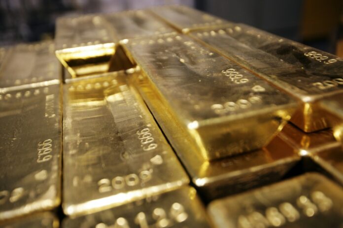 Stocks waver, gold futures hit record on US tariff updates