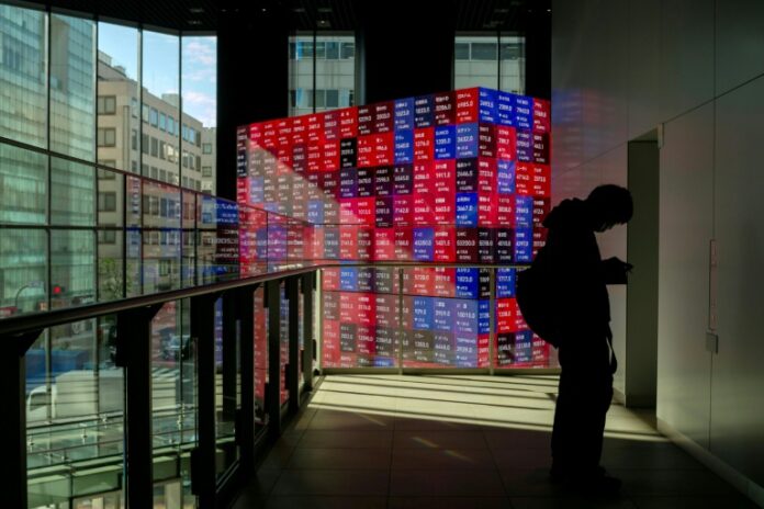 Asian markets drop with Wall St as tech fears revive